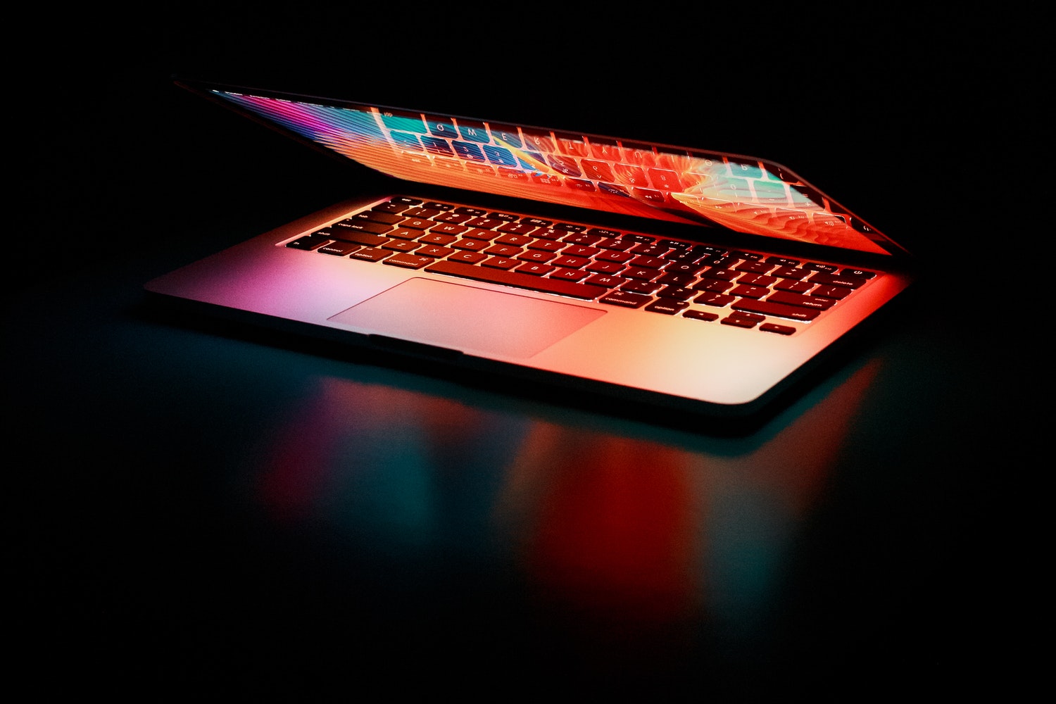 semi opened-laptop-computer-turned-on-on-table-2047905